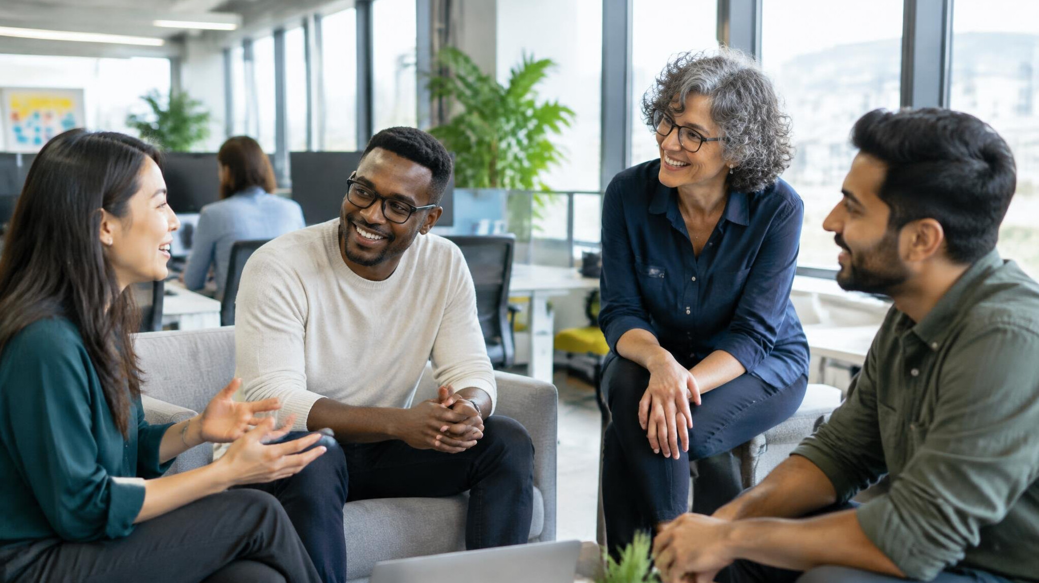 Diverse office team having a friendly discussion at work